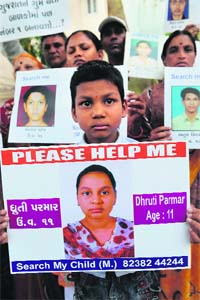 Family members and relatives participate in a Missing Children rally in Ahmedabad