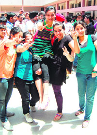 Students of DAV Public School celebrate after their excellent performance in CBSE Class XII exams in Amritsar on Monday. 