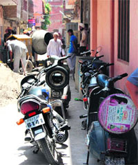 Encroachments in a narrow lane; and (below) commercial activities go unchecked in a residential area in Ward 21 in Amritsar. 