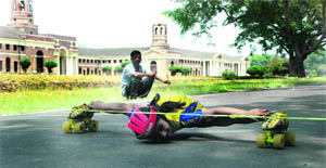 Pragya, a seven-and-a-half-year old skater, practises to cross under a six-inch bar for making it to Guinness Book of World Records in Dehradun on Monday. 