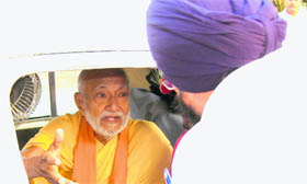 Swami Gyan Swaroop Sanand being stopped by the police while on his way to the Alaknanda valley in Srinagar, Garhwal, in Haridwar on Monday.