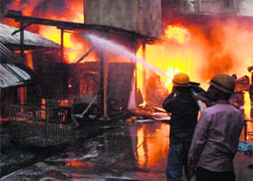 Firefighters try to douse flames in a company at Manesar in Gurgaon on Monday