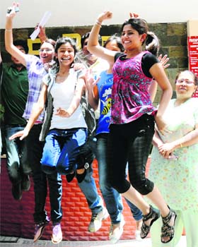 JUMPING WITH JOY: Students of Pratap Public Senior Secondary School celebrate their results in the CBSE Class XII examinations in Karnal on Monday
