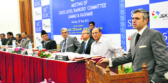 Chief Minister Omar Abdullah addresses a meeting of the Jammu and Kashmir State Level Bankers Committee in Srinagar on Monday. 