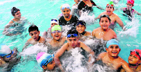 Children enjoy themselves in the swimming pool at Sector 23 in Chandigarh on Tuesday.