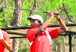 A player hits a shot during golf championship at the Golf Club in Chandigarh on Tuesday.