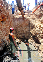Repair work in progress to clear the blockage in the main sewer line which reportedly got damaged during the laying of a 66-kv cable by GMADA at Kumbra traffic light in Mohali.