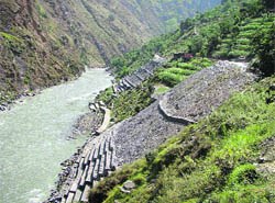 NHPC officials execute rehabilitation work along the Ravi. 