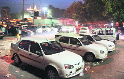 Taxis parked at a stand at the Jammu railway station. Charging of excessive fares by taxi operators has been causing discomfort to tourists visiting the state. Tribune Photo: Inderjeet Singh