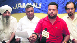 Members of the State Government Employees Joint Action Committee address a press conference in Jammu on Tuesday. Tribune photo: Inderjeet Singh