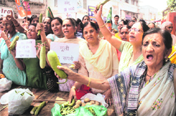 Activists of the BJP Mahila Morcha hold a protest against price rise in Jammu on Tuesday. Tribune photo: Anand Sharma