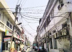 High-tension wires pose a threat to residents’ lives. These can cause a short-circuit in the area. The authorities need to take immediate measures to solve the problem. Photo: Inderjeet Verma