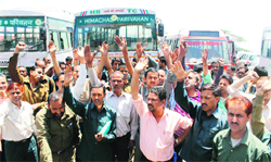 Employees of the HRTC raise slogans in support of their demands at the Old Bus Stand in Shimla on Wednesday. Photo: Amit Kanwar