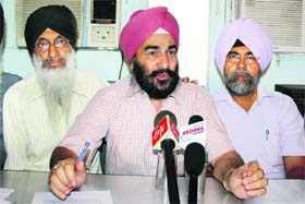 Members of the National Sikh Front, Jammu and Kashmir, address a press conference in Jammu on Wednesday