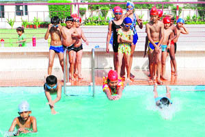 Students of Bal Bharti School enjoy swimming during a summer camp in Ludhiana.