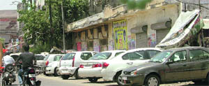 Vehicles parked along a road at Ward No. 53 in Ludhiana