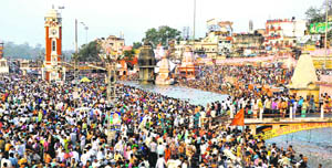 Devotees take a dip in the Ganga in Haridwar on Thursday. 