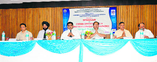 Dignitaries share the dais during a seminar on Career Opportunities and Recent Developments in Commerce at Gita Niketan Awasiya Vidyalaya in Kurukshetra. 