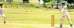 A batsman cuts for a single during a cricket match at GGM Science College hostel ground in Jammu on Thursday