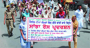 Members of various organisations take out a protest march against the hike in the price of petrol in Bathinda on Friday.