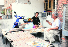 Vandana with her family at Sector 46 in Chandigarh on Thursday.