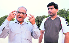 The maternal uncle (right) and grandfather of the murder victims explain their viewpoint at their house in Sector 41 of Chandigarh on Friday. 