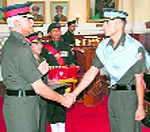 Lt-Gen Manvendra Singh, Commandant, Indian Military Academy, honours a winning cadet during the Army Cadet College (ACC) graduation ceremony in Dehradun on Friday