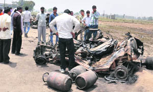 LPG gas cylinders and a vehicle that were burnt in the blasts while cooking gas was being pilfered near Kohand village in Karnal on Friday morning.