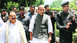 BJP leader Rajnath Singh with party leaders in Srinagar on Friday. Photo: Mohd Amin War