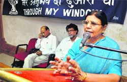 Prof Veena Gupta, convener, Dogri Advisory Board, delivers a welcome note during a programme at KL Seghal Hall in Jammu on Friday. Tribune photo: Anand Sharma