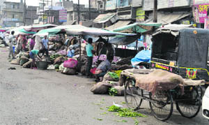 A makeshift vegetable market on the encroached portion of the road at ward number 17 in Ludhiana. 