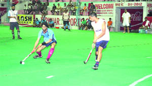 Players in action during the Prithipal Singh Memorial Hockey Festival being organised at Jarkhar village in Ludhiana.