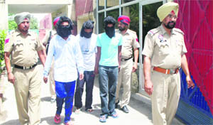 The members of the robbers gang being produced in the court at Jagraon on Friday. 