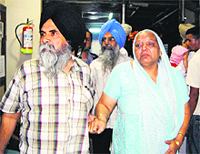 Amarjit Kaurs parents arrive at a hospital in Amritsar on Saturday