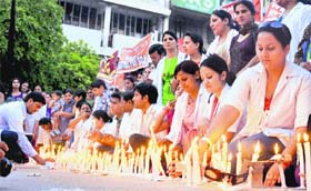 Nurses of the GMCH, Sector 32, light candles to mark their protest in favour of their demands at the Sector-17 Plaza in Chandigarh on Saturday