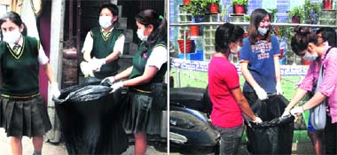 Students of Woodstock School (left) and Tibetan Homes Foundation School pick up garbage from roads during a clean-Mussoorie rally on Saturday