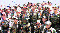 Indian cricket team captain Mahendra Singh Dhoni flanked by Army personnel at a forward post in Poonch on Saturday