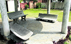 Broken concrete benches in a park at New Baradari