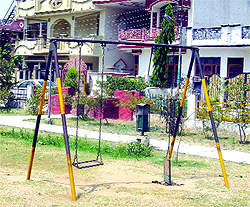 Garbage dumped near PIMS; and (below) broken swings in a park at Chhoti Baradari in Ward 32 in Jalandhar