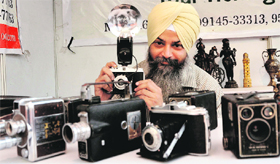 Narinderpal Singh shows his antique cameras in Ludhiana.