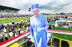 A cardboard cut-out of Queen Elizabeth on an old London bus during Ladies Day at the Epsom Derby festival on Saturday