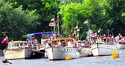 Boats that will be part of the Jubilee river pageant are docked in Putney on the Thames in London on Saturday