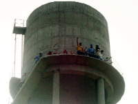 Teachers protest atop a water tank in village Lehra Dhurkot.