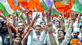 Supporters of Anna Hazare and yoga guru Baba Ramdev at Parliament Street in New Delhi on Sunday.