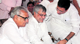 Chief Minister Bhupinder Singh Hooda and Union Minister of Road, Transport and Highways CP Joshi (centre) inaugurate development works during the Vikas rally in Jind on Sunday.