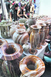 People buy products at an exhibition, Destination Himachal Mega Mart, organised by Himachal Tourism and the PHD Chamber in Shimla on Sunday.