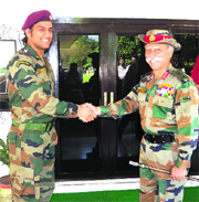 Lt Col MS Dhoni meets Lt Gen KT Parnaik, GOC-in-C, Northern Command, during his visit to the Northern Command Headquarters on Sunday.