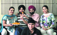 Ekjot Singh, who got the 65th rank in the AIPMT, celebrates his success with his family in Ludhiana on Sunday. A Tribune photograph