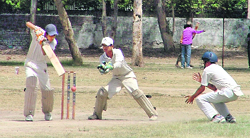 A batsman plays a shot at SCD Government College ground in Ludhiana on Sunday. photo: inderjeet verma
