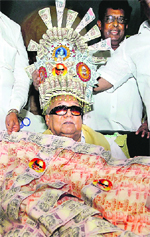 DMK chief M Karunanidhi with his party workers during his 89th birthday celebrations at Anna Arivalayam in Chennai